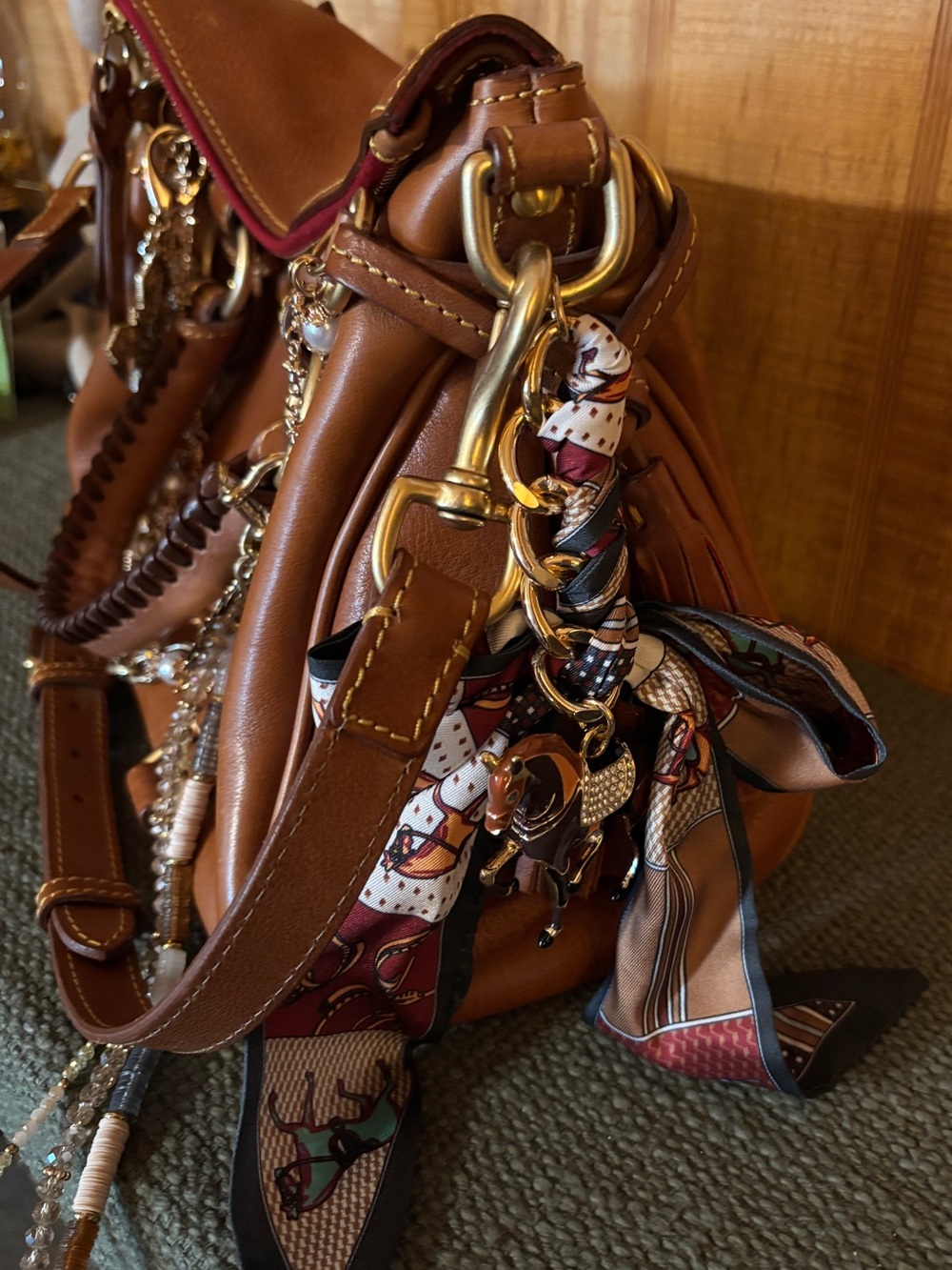 Dooney & Bourke leather tan handbag with Chain Accents & charms. - Picture 3 of 5